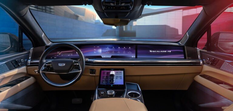Interior cabin view of the Escalade EXT showcasing digital displays and smart connectivity features